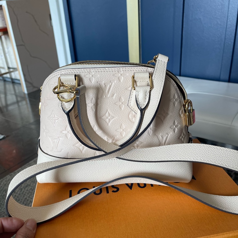 Small Louis Vuitton cream color with the shoulders stripe
